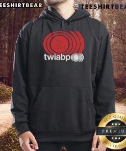 Person wearing a 'Top The World Is A Beautiful Place' hoodie in a scenic outdoor setting, embracing nature and life.
