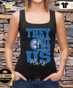 Stylish Philadelphia 76ers basketball tank top featuring 'Top They Not Like Us' graphic for fans and sports enthusiasts.
