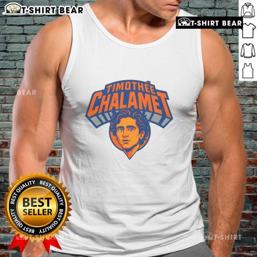 Timothe Chalamet in New York wearing a stylish tank top, showcasing his trendy fashion sense as a top actor.