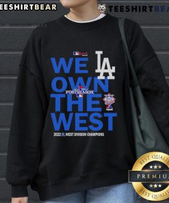 Alt Text: Top We Own The West Dodger Champions West Division Sweatshirt in blue, celebrating Dodgers' victory.