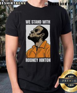 Top We Stand With Rodney Hinton T-Shirt featuring bold text design to support Rodney Hinton's cause and message.