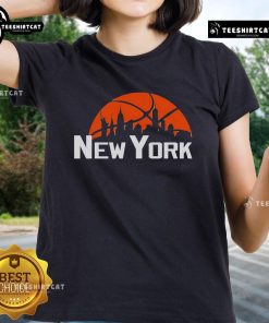 Premium New York Knicks cityscape skyline style 2025 ladies tee featuring vibrant team colors and modern design.