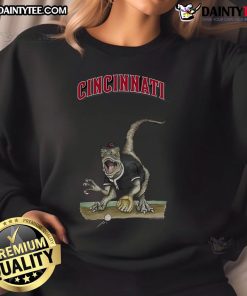 Awesome Cincinnati Reds Tiny Turnip Velociraptor Sweatshirt featuring a playful dinosaur design for fans.