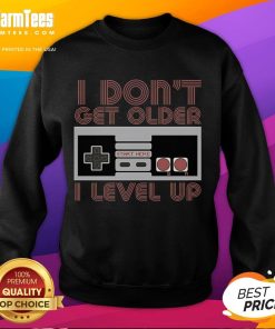 Awesome 'I Don't Get Older, I Level Up' retro gamer sweatshirt showcasing vibrant gaming graphics and comfortable style.