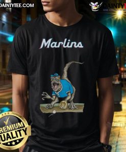 Alt Text: Awesome Miami Marlins Tiny Turnip Velociraptor T-Shirt featuring a fun dinosaur design for fans.