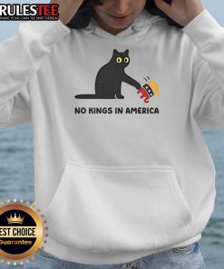 Alt Text: Cute black cat wearing a 'No Kings in America' hoodie with an elephant, symbolizing playful political satire.