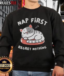 Cute cat napping in cozy 'First Regret Nothing' sweatshirt, showcasing comfort and style for cat lovers.