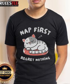 Cute cat napping on a cozy blanket, featuring the phrase First Regret Nothing on a trendy T-Shirt. Perfect for cat lovers!