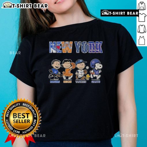 Alt Text: Cute Peanuts graphic tee featuring New York Rangers, Knicks, Yankees, and Giants for ladies. Perfect for sports fans!