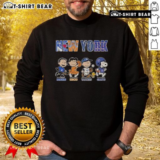 Alt Text: Cute Peanuts sweatshirt featuring New York Rangers, Knicks, Yankees, and Giants logos, perfect for sports fans.