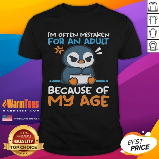 Cute penguin graphic on a T-shirt, humorously labeled 'Often Mistaken For An Adult Because Of My Age.' Perfect for penguin lovers!