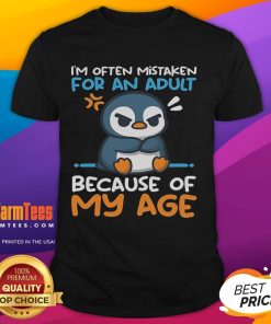 Cute penguin graphic on a T-shirt, humorously labeled 'Often Mistaken For An Adult Because Of My Age.' Perfect for penguin lovers!