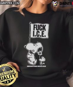 Cute Snoopy and Woodstock on a sweatshirt with 'Fck Ice, Flag Immigrants, Make America Great' design.