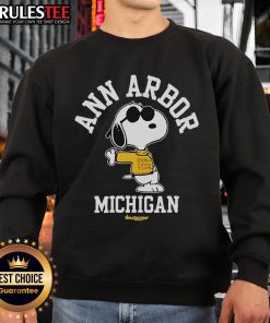 Cute Snoopy Ann Arbor Michigan 2025 Tour sweatshirt featuring vibrant graphics and cozy design for fans.