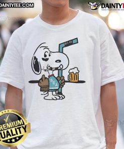 Alt Text: Cute Snoopy player in Seattle Kraken hockey jersey, humorously showing middle finger on a fun T-shirt design.