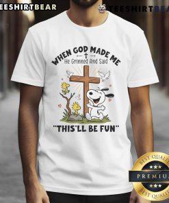 Alt Text: Cute Snoopy graphic on a t-shirt with the quote, When God Made Me He Grinned And Said This'll Be Fun.