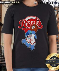 Cute Stitch playing baseball in a Cincinnati Reds ladies tee, showcasing team spirit and style for fans.