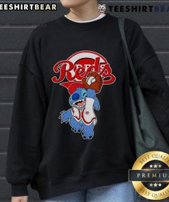 Alt Text: Cute Stitch playing baseball in a Cincinnati Reds sweatshirt, perfect for fans and stylish sportswear enthusiasts.