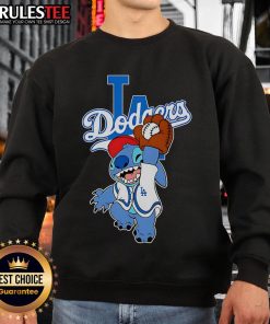 Cute Stitch character wearing a Los Angeles Dodgers sweatshirt while playing baseball, perfect for fans and collectors.