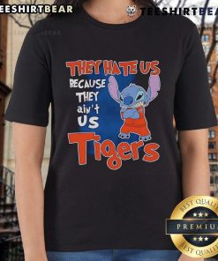 Cute Stitch Detroit Tigers ladies tee featuring 'They Hate Us Because They Ain't Us' slogan in vibrant colors.