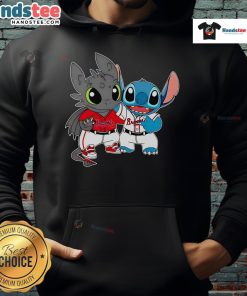 Alt Text: Cute Toothless Night Fury and Stitch in Atlanta Braves baseball hoodie, perfect for fans and cozy casual wear.