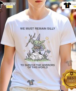 Alt Text: Cute We Must Remain Silly To Survive The Horrors Of This World T-Shirt design featuring playful typography and vibrant colors.
