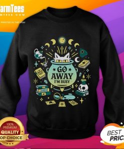 Cute witch cat at work on a 'Go Away I'm Busy' sweatshirt, perfect for cat lovers and Halloween enthusiasts.