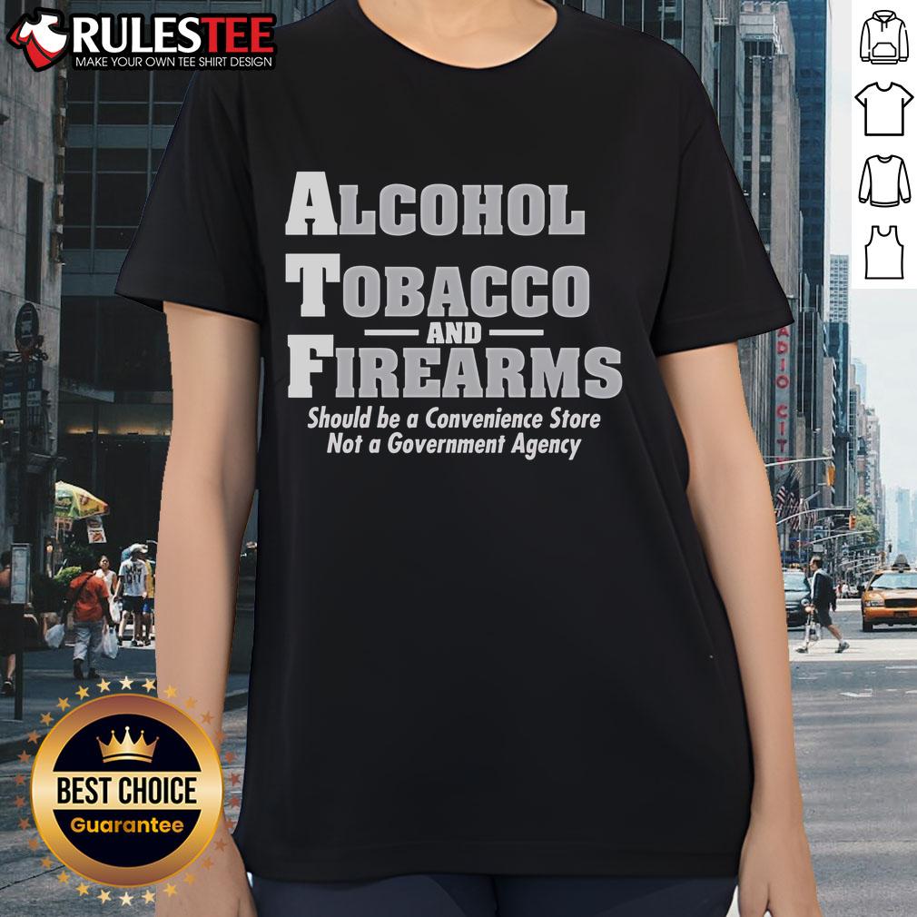 Funny Alcohol Tobacco And Firearmns Should Be A Convenience Store Ladies Tee Funny alcohol, tobacco, and firearms graphic on a ladies' tee, perfect for casual wear at the convenience store.