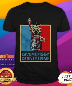 Funny 'Give Me Piggy Or Give Me Death' T-Shirt featuring humorous pig graphics and bold text design.