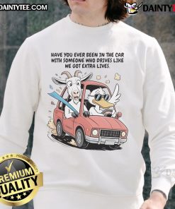 Funny goat and duck in a car wearing Extra Life sweatshirt, capturing the humor of wild rides and quirky companions.