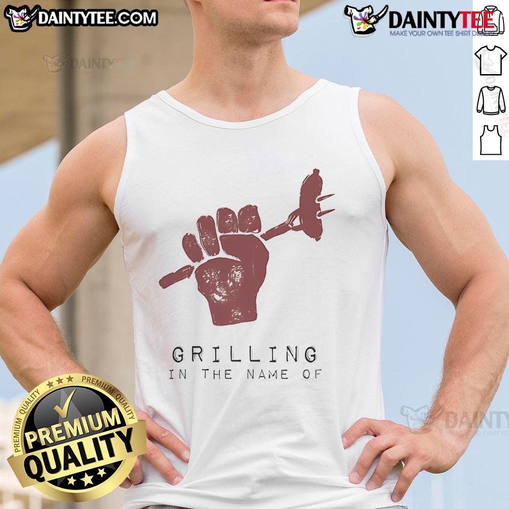 Funny Grilling In The Name Of Tank Top Man wearing a tank top humorously grilling outdoors, showcasing a fun summer vibe and cooking skills.