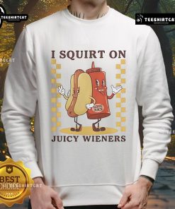 Funny sweatshirt featuring a quirky design with the phrase I Squirt On Juicy Wieners Love Juice and hotdog graphics.