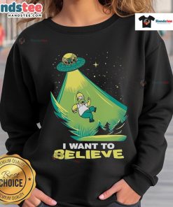 Funny 'I Want to Believe' Homer Simpson UFO sweatshirt featuring iconic cartoon character and humorous design.