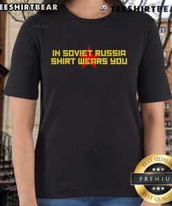 Funny 'In Soviet Russia, Shirt Wears You' Ladies Tee displayed on a model, showcasing humor and unique style.