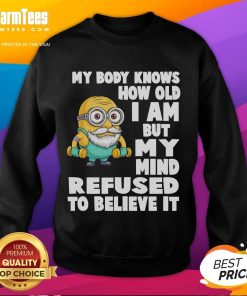 Funny Minion sweatshirt with 'My Body Knows How Old I Am, But My Mind Refuses to Believe It' text, perfect for casual wear.
