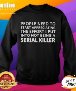 Funny sweatshirt saying 'Appreciate My Effort Not Being a Serial Killer' worn by a person with a playful expression.