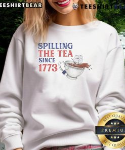 Funny 'Spilling The Tea Since 1773' sweatshirt featuring a humorous design perfect for tea lovers and history buffs.