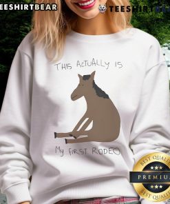 Funny 'This Actually Is My First Rodeo' horse sweatshirt featuring a playful design for rodeo enthusiasts.