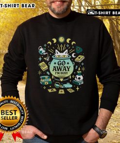 Alt Text: Funny witch cat at work on a sweatshirt, saying Go away, I'm busy, perfect for cat lovers and Halloween enthusiasts.