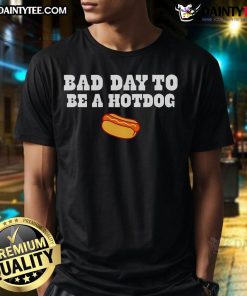 Good Bad Day To Be A Hot Dog '25 T-Shirt featuring playful hot dog graphic, perfect for food lovers and fun fashion.