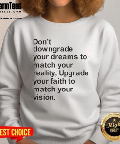 Motivational sweatshirt with 'Don't Downgrade Your Dreams to Match Your Reality' text, perfect for inspiring confidence.