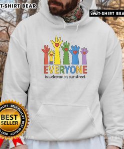 Colorful hands on a hoodie that reads 'Good Everyone Is Welcome On Our Street' for LGBT Pride Month celebration.