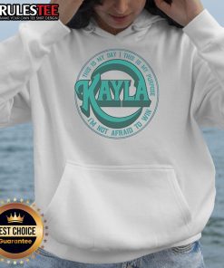Kayla Harrison wearing a concert hoodie with 'This Is My Day, This Is My Purpose, I'm Not Afraid To Win' design.
