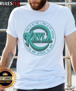 Alt Text: Kayla Harrison concert t-shirt featuring 'This Is My Day, This Is My Purpose, I'm Not Afraid To Win' slogan.