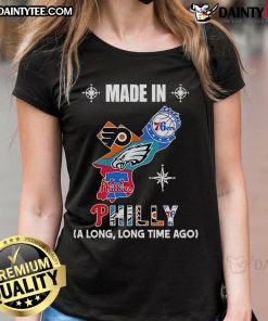 Vintage logos of Phillies, Eagles, 76ers, and Flyers on a map design for 'Made In Philly' ladies tee.
