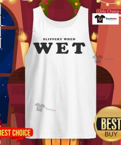 Renee Rapp wearing a 'Slippery When Wet' tank top, showcasing her stylish look and vibrant personality on stage.