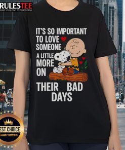 Alt Text: Good Snoopy tee for ladies featuring a sweet message about loving someone more on their bad days.