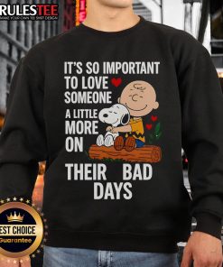 Alt Text: Good Snoopy sweatshirt with 'Love Someone More on Bad Days' text, featuring a cute Snoopy graphic.