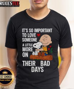 Alt Text: Good Snoopy T-shirt with 'Love Someone More on Bad Days' quote, promoting kindness and support in tough times.