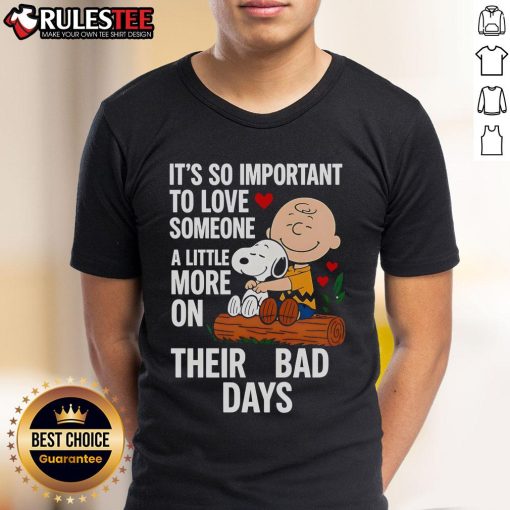 Alt Text: Good Snoopy T-shirt with 'Love Someone More on Bad Days' quote, promoting kindness and support in tough times.
